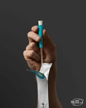 hand holding Coloplast speedicath soft catheter