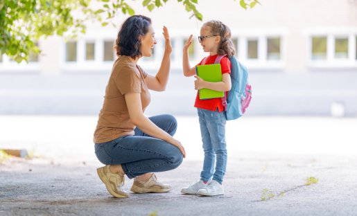 mom and child high-fiving
