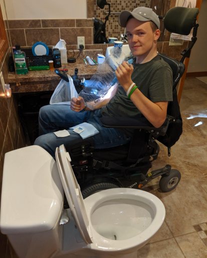 mason holding the ez gripper catheter