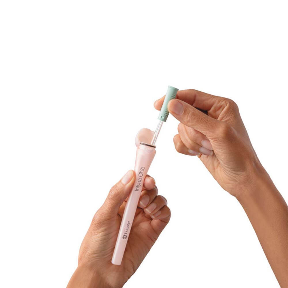 hands pulling hollister infyna chic female catheter from case