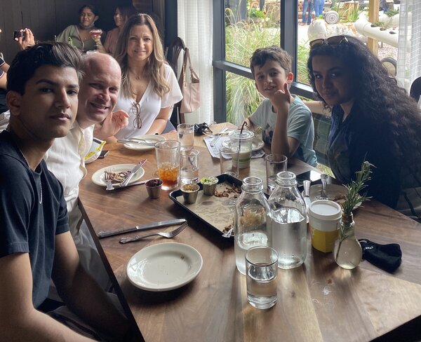 Meena eating dinner with her family