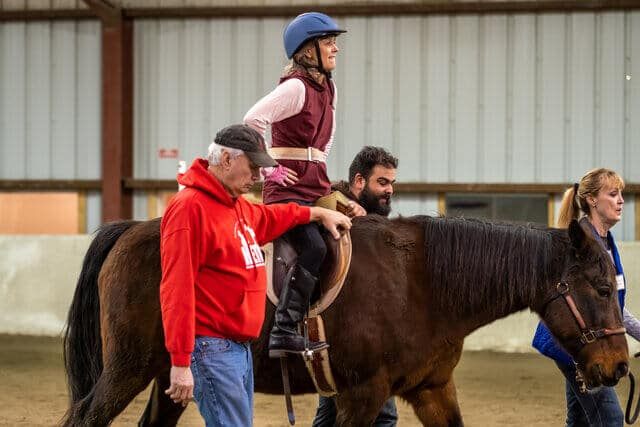 Julie doing horseback riding therapy