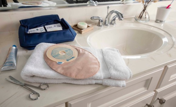 colostomy bag and ostomy supplies on bathroom counter