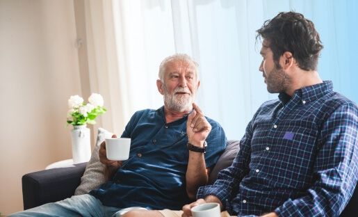man and father sitting on couch