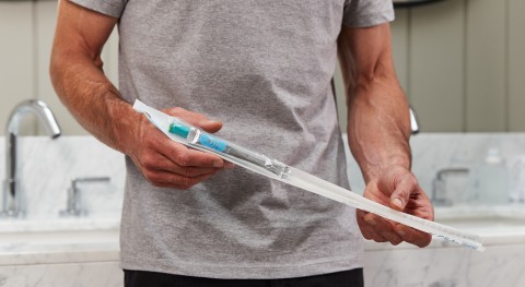 Man holding gentlecath glide catheter